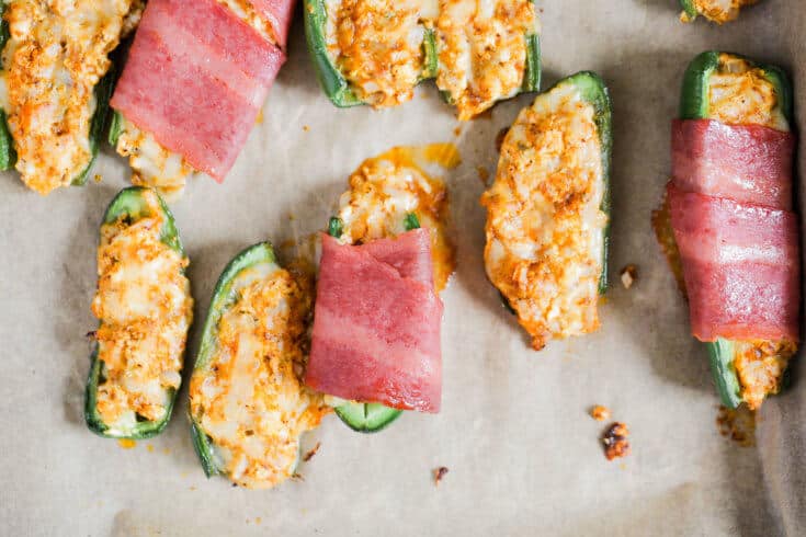 Plates of jalapeño poppers with avocado ranch dressing